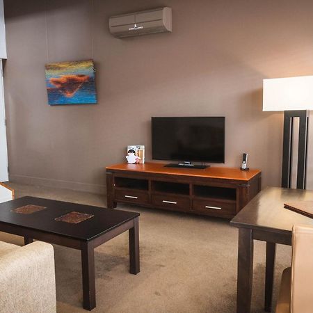 The Henry Jones Art Hotel Hobart Ngoại thất bức ảnh A living room in a typical apartment at the Village at Grand Traverse Commons